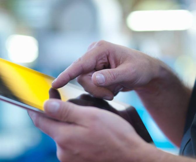 A person holding a tablet