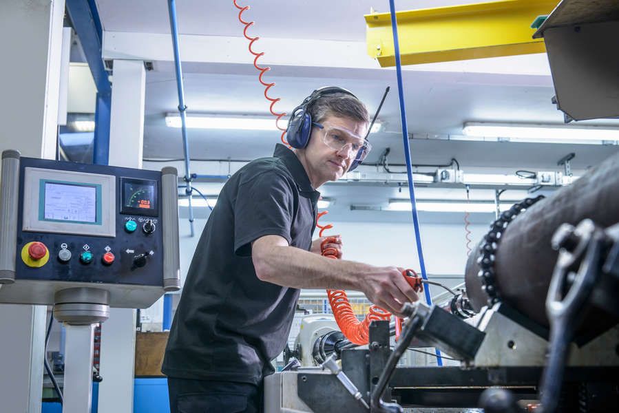 Worker performing test on machinery
